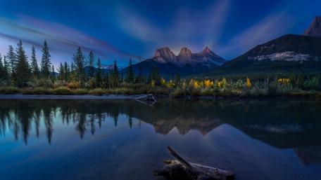 Twilight Reflections of the Three Sisters in Kananaskis Rockies wallpaper
