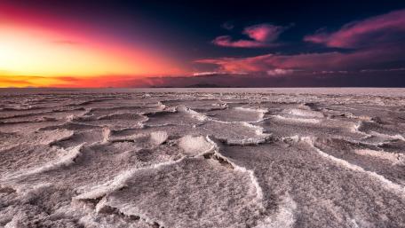 Crimson Sunset Over Uyuni Salt Flat Horizon in Bolivia wallpaper
