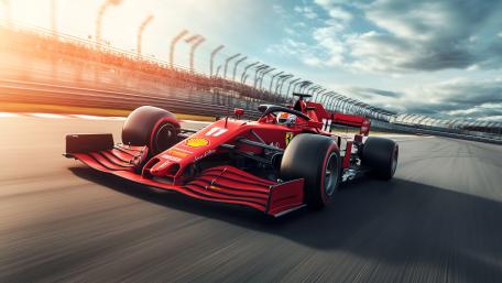 Sunlit Formula One Speeding Through the Circuit in 5K Glory wallpaper