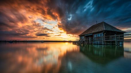 Sunset Reflections at the Boathouse on Lake Ammersee Bavaria wallpaper