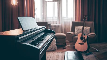Cozy Music Room with Piano and Acoustic Guitar in Soft Light wallpaper