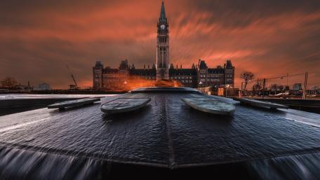 Peace Tower Rising Over Ottawa at Fiery Sunset wallpaper