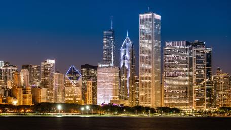 Chicago Night Skyline Glowing Over Lake Michigan wallpaper