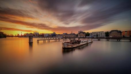 Golden Sunset Reflections Over Berlin Skyline on the Calm Spree River wallpaper