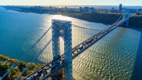 Sunlit George Washington Bridge Over the Hudson River in New York City wallpaper