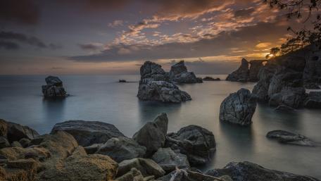 Silent Sea Stacks at Dusk Beneath a Painted Sky wallpaper