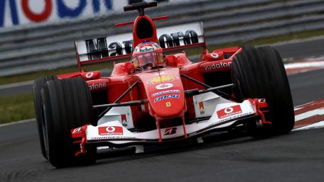 Scuderia Ferrari Formula 1 Machine Charging Through a Fast Corner wallpaper