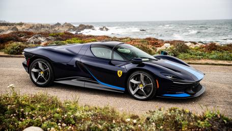 Ferrari SP8 Supercar Posed on a Rugged Coastal Road wallpaper