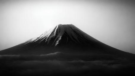 Monochrome Volcano Peak Rising Above Silent Cloud Sea wallpaper