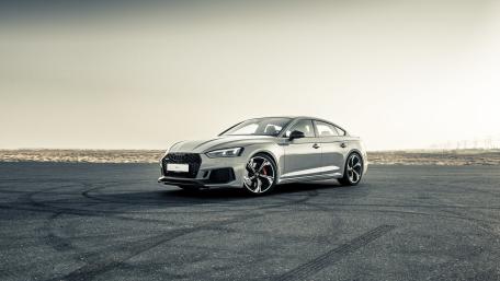 Silver Audi RS5 Coupe Poised on Open Desert Asphalt wallpaper
