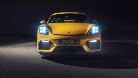 Midnight Spotlight on Yellow Porsche 718 Cayman GT4 Power wallpaper