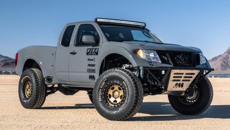 Desert Ready Nissan Frontier Off Road Pickup on Rugged Tires wallpaper