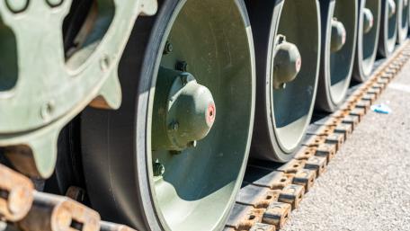 Steel Tracks and Road Wheels Close Up Military Tank Wallpaper wallpaper