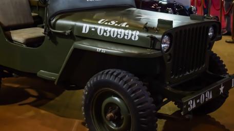 Classic Olive Drab Military Jeep Ready for Rugged Off Road Missions wallpaper
