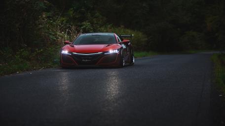 Crimson Acura NSX Type S Gliding Through a Quiet Forest Road wallpaper