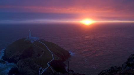 South Stack Lighthouse at Sunset Over the Irish Sea wallpaper