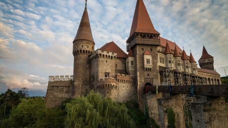 Vajdahunyad Castle at Sunset Hunedoara Romania Medieval Stone Fortress Wallpaper wallpaper