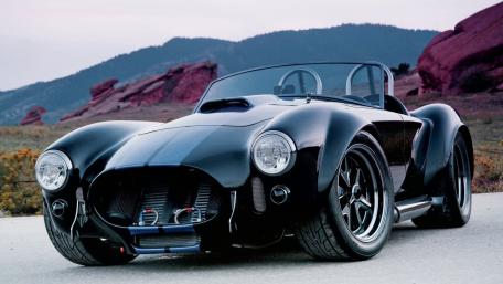 Midnight 1965 Shelby Cobra Roadster in Mountain Light wallpaper