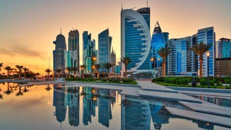 Doha West Bay Skyline Reflected in Sunset Waters wallpaper