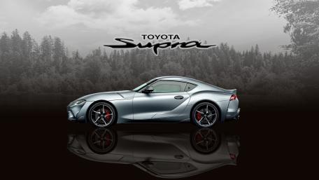 Monochrome Toyota Supra MK5 Reflection Against Misty Forest Backdrop wallpaper