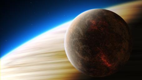 Shadowed Moon Over a Ringed Outer Planet in Deep Space wallpaper