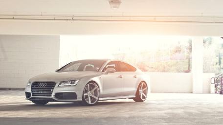 Sunlit Audi A7 Elegance in a Minimalist Parking Garage wallpaper