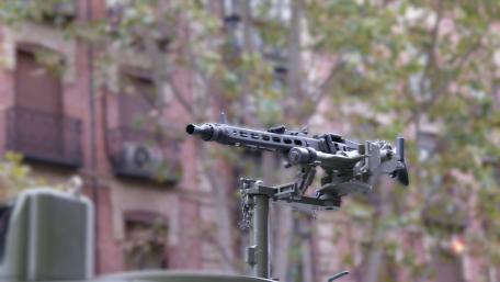 Mounted Heavy Machine Gun Aiming Over Urban Street in 5K Detail wallpaper