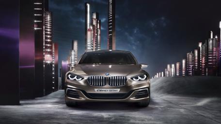 BMW Compact Sedan Under Neon City Lights wallpaper