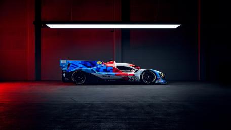 BMW M Hybrid V8 Endurance Racer Under Neon Garage Light wallpaper