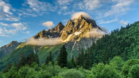 Golden Morning Clouds Over the Rugged Caucasus Mountains wallpaper