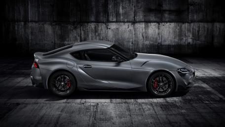 Monochrome Toyota GR Supra Silhouette in a Gritty Urban Garage wallpaper