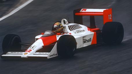 McLaren MP4/4 Formula 1 Legend Cutting Through Wet Tarmac wallpaper