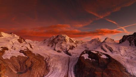 Crimson Sunset Over Monte Rosa Ridge in the Swiss Alps wallpaper