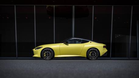 Sleek Yellow Nissan Z Profile in Shadowy Urban Glass wallpaper