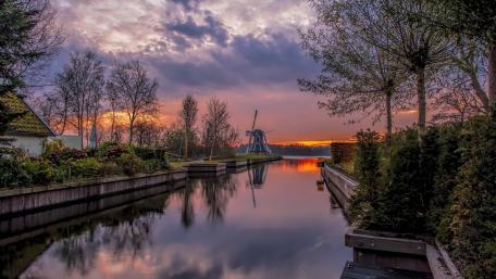 Windmill Serenity at Dusk on Paterswoldsemeer in Haren Netherlands wallpaper
