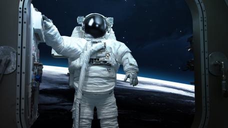 Lone Astronaut Drifting Above a Silent Midnight Earth wallpaper