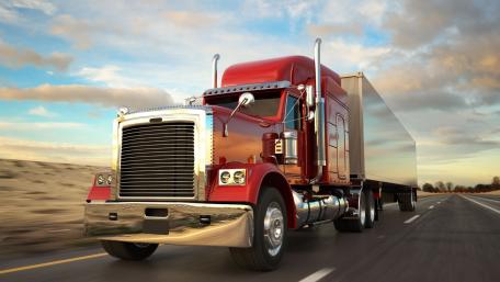 Crimson Semi Trailer Truck Rolling Through Open Highway Skies wallpaper