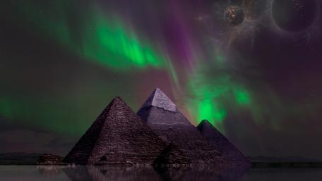 Aurora Crowned Pyramids in a Cosmic Fantasy Night wallpaper