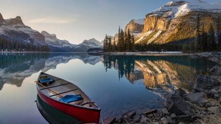 Tranquil Canoe Reflections at Spirit Island on Maligne Lake wallpaper
