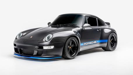 Carbon Black Porsche 911 With Blue Accent Studio 4K Wallpaper wallpaper