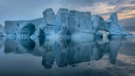 Silent Arctic Iceberg Reflections on a Glassy Polar Sea wallpaper