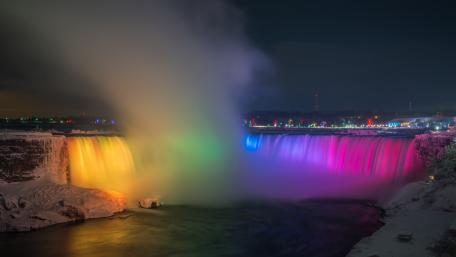 Rainbow Lit Niagara Falls Nightscape Over the Niagara River in Canada wallpaper