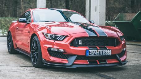 Red Ford Mustang Shelby in 4K with Bold Racing Stripes wallpaper
