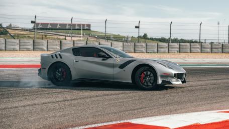 Ferrari F12tdf Trackside Drift in Sleek Silver 4K Wallpaper wallpaper