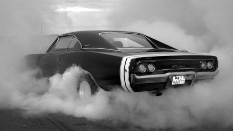 Smoky Burnout with a Classic Dodge Charger R T Muscle Car wallpaper