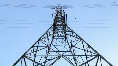Monumental Power Pylon Geometry Against a Clear Blue Sky wallpaper