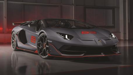 Matte Grey Lamborghini Aventador SVJ with Red Accents in Studio Light wallpaper