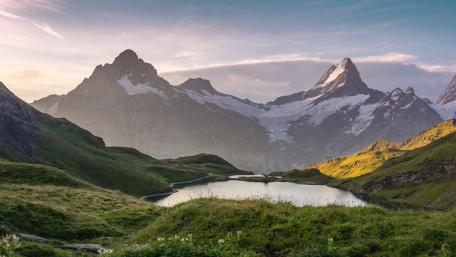 Serene Sunrise Reflections Over Bachalpsee In The Swiss Alps wallpaper