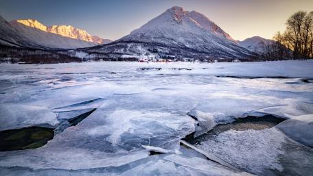 Frozen Dawn Over Ramfjorden Mountains in Norway wallpaper
