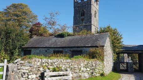 Medieval Stone Walls and Church Tower in Rural Penmaen Wales wallpaper